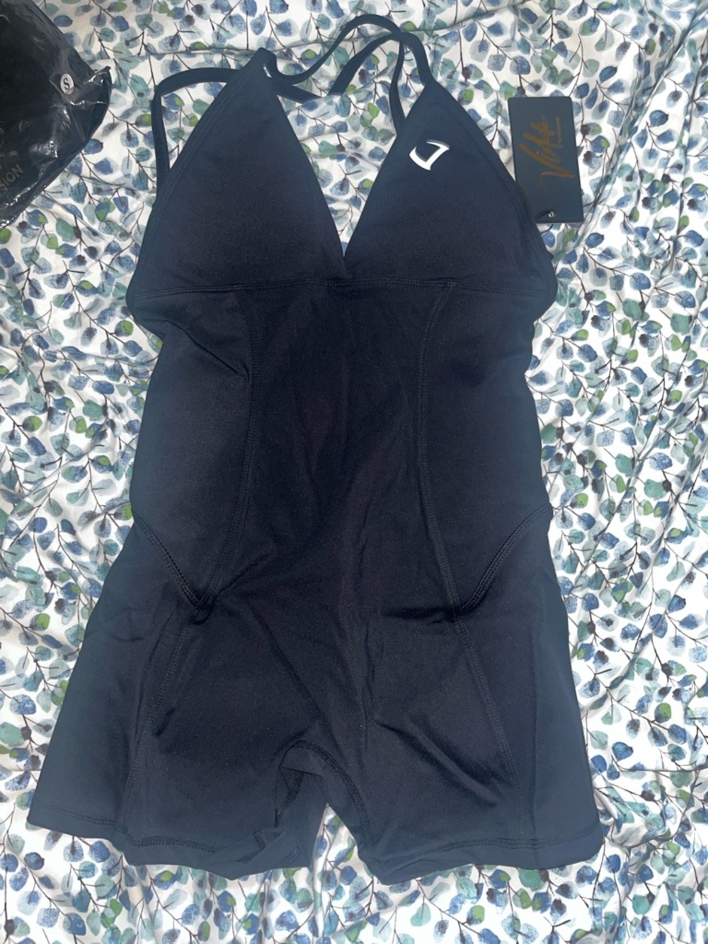 Violate The dress code 
Black One-Piece Active Romper with Deep V